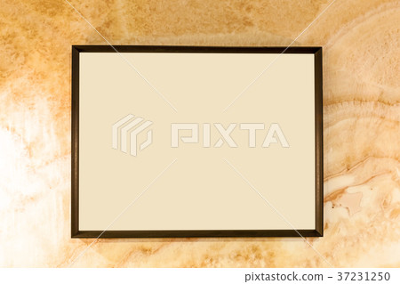 Aged wall texture with blank photo frame 37231250