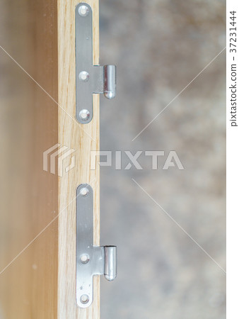 Iron hinges in wooden door 37231444