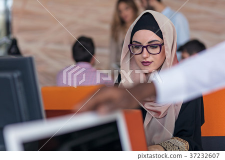 Attractive Muslim young woman working in office on 37232607
