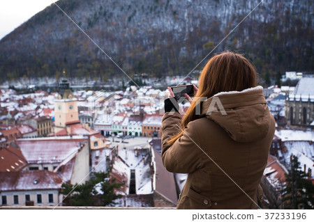 gril taking a photo of an old city gril taking a photo of an old city 37233196