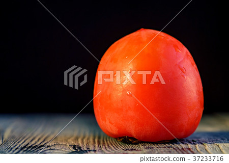 Ripe persimmon with water drops. Selective focus 37233716