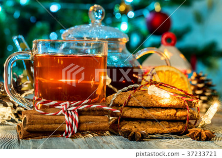 Cozy still life with tea, candle light and cookies 37233721
