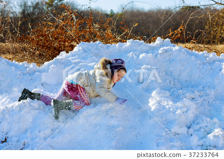 Kids play outside winter season 37233764
