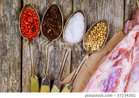 A large piece of pork with herbs and spices 37234302