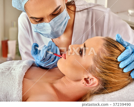 Dermal fillers of woman in spa salon with Dermal fillers of woman in spa salon with 37239490
