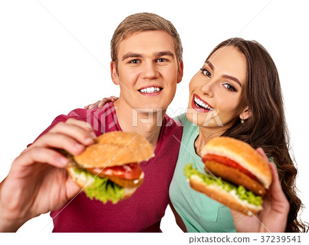 Couple eating fast food. Man and woman eat Couple eating fast food. Man and woman eat 37239541