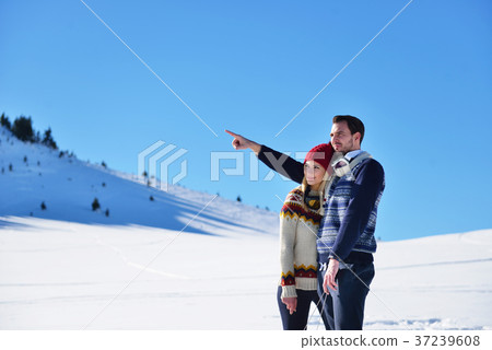 Young Couple Sledding And Enjoying On Sunny Winter Young Couple Sledding And Enjoying On Sunny Winter 37239608