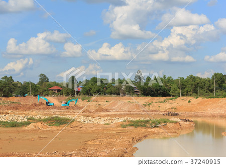Backhoe dredging swamps for agriculture   37240915