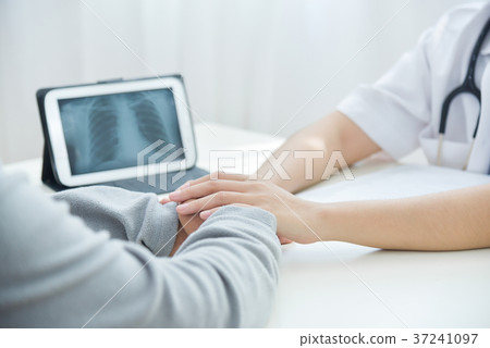 Female doctor comforting senior male patient. 37241097