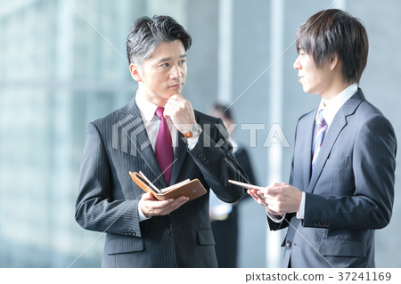 Male business image of businessman suits showing conversation 37241169