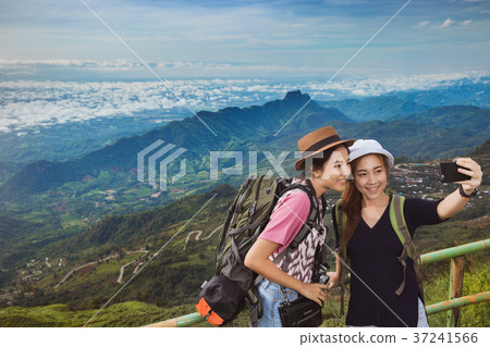 Asian tourists are enjoying selfie with friends 37241566