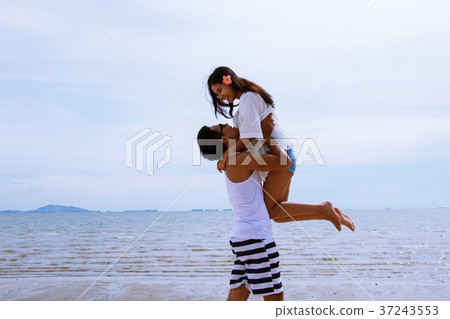 Couple together at beach in Thailand Couple together at beach in Thailand 37243553