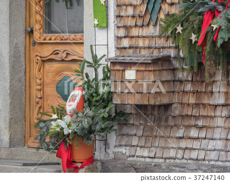 A mailbox on the wall with wooden shingles A mailbox on the wall with wooden shingles 37247140