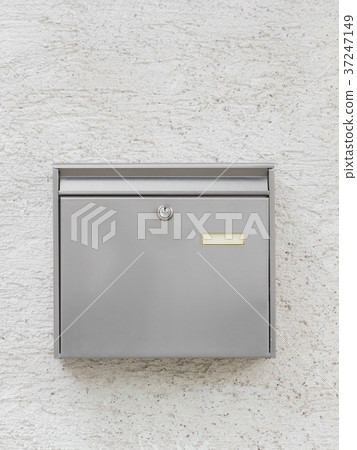 A silver mailbox on the wall 37247149