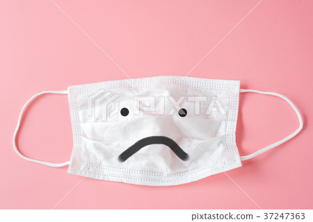 Unhappy face on Protective white face mask  37247363
