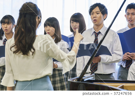 Music teacher and choir practice 37247656
