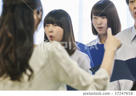 Music teacher and choir practice 37247658