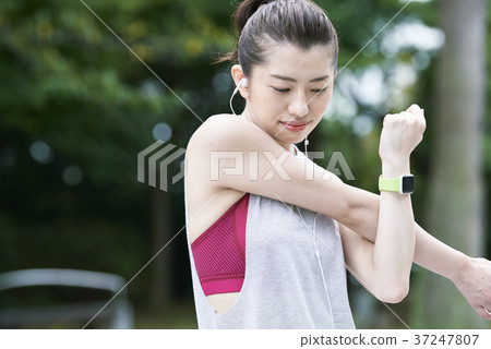 Young woman park stretching Young woman park stretching 37247807