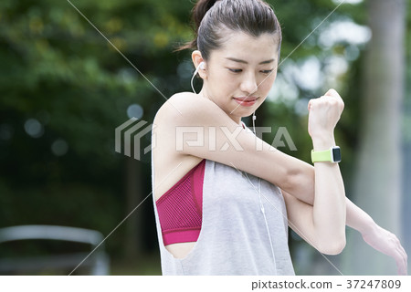 Young woman park stretching Young woman park stretching 37247809