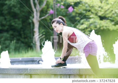 Young woman park stretching 37247828