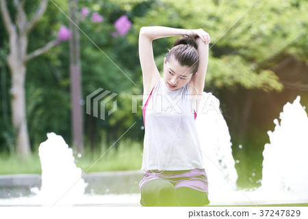 Young woman park stretching Young woman park stretching 37247829