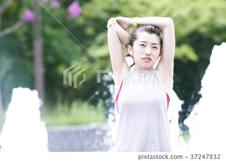 Young woman park stretching Young woman park stretching 37247832