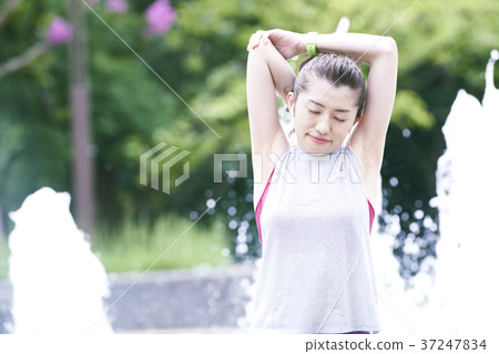 Young woman park stretching Young woman park stretching 37247834