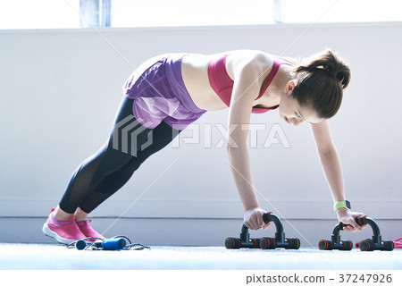 Young woman training indoors 37247926
