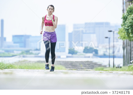 Young woman running in the park Young woman running in the park 37248178
