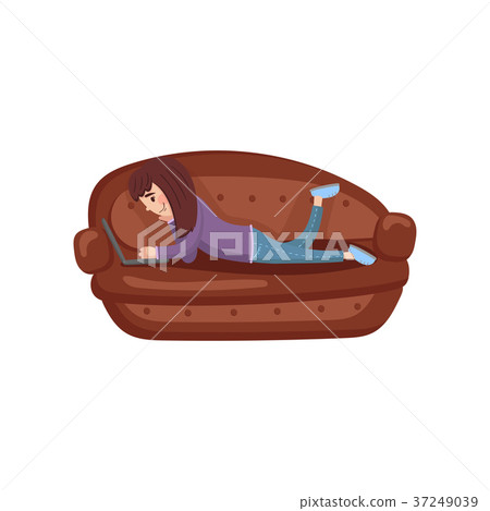 Girl lying on her stomach on a sofa using a laptop Girl lying on her stomach on a sofa using a laptop 37249039
