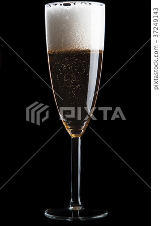 Champagne glass on black background Champagne glass on black background 37249143