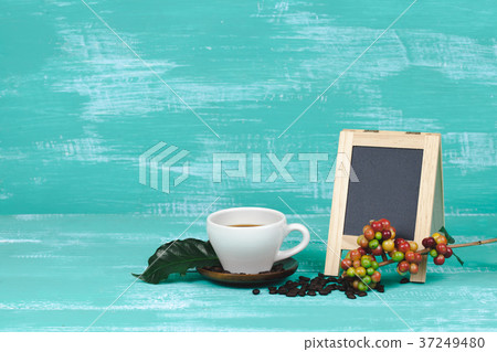 fresh coffee beans with cup of hot coffee  37249480