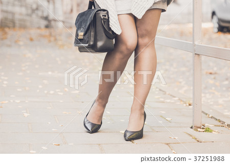 Woman legs wearing black high heel shoes Woman legs wearing black high heel shoes 37251988