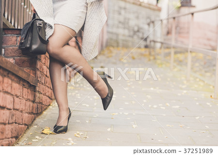 Woman legs wearing black high heel shoes Woman legs wearing black high heel shoes 37251989