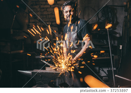 man using angle grinder sparks 37253897