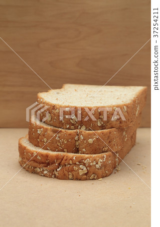 Whole grain beard on brown paper background. Whole grain beard on brown paper background. 37254211