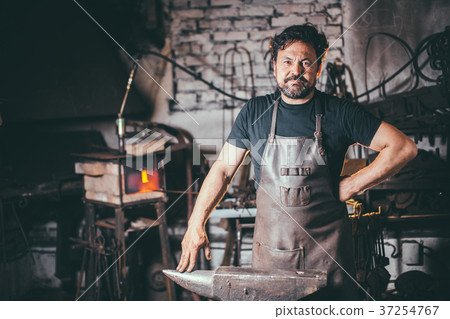 portrait of blacksmith preparing to work metal on 37254767