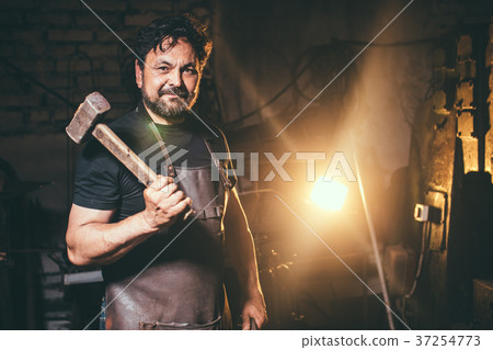portrait of blacksmith preparing to work metal on 37254773