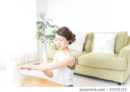 A woman doing hand care A woman doing hand care 37255325