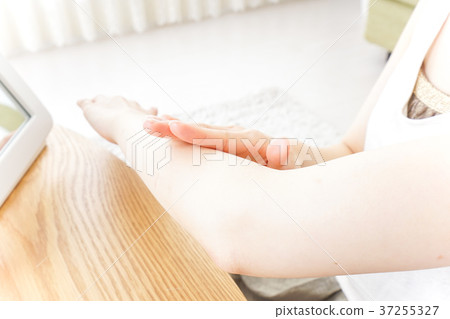 A woman doing hand care A woman doing hand care 37255327