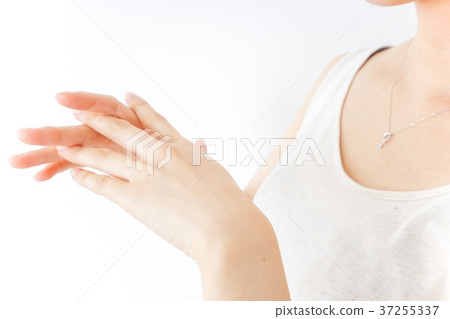 A woman doing hand care A woman doing hand care 37255337