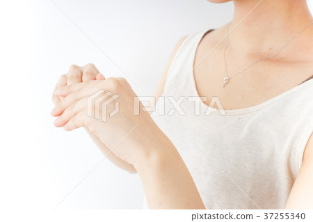 A woman doing hand care A woman doing hand care 37255340