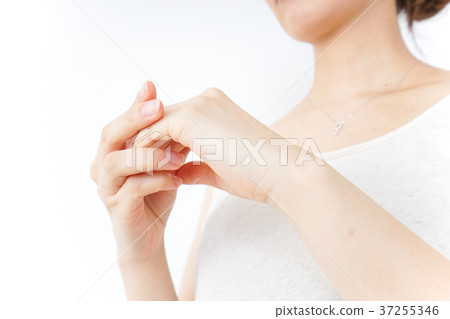 A woman doing hand care A woman doing hand care 37255346