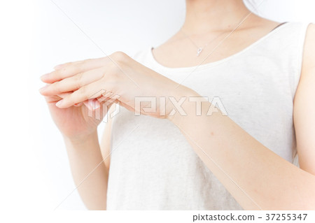 A woman doing hand care A woman doing hand care 37255347