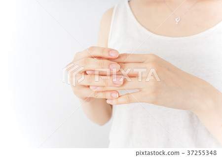 A woman doing hand care A woman doing hand care 37255348