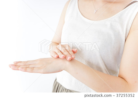 A woman doing hand care A woman doing hand care 37255352