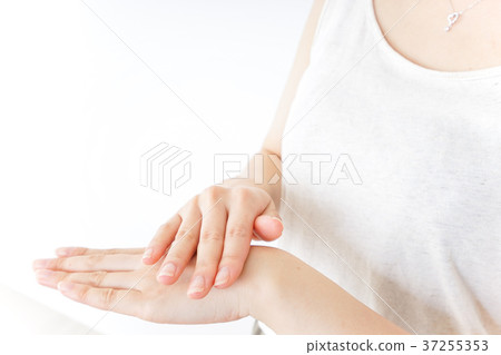 A woman doing hand care A woman doing hand care 37255353
