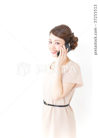 Woman in fashionable clothes using a smartphone 37255513
