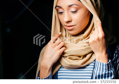 pretty muslim girl in hijab in cafe pretty muslim girl in hijab in cafe 37255550