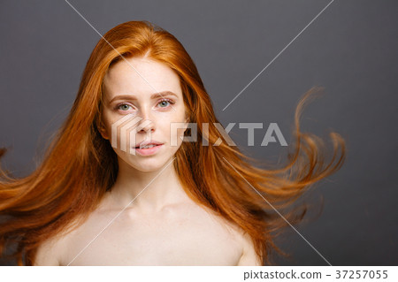 happy woman with cute smile, ginger hair and 37257055